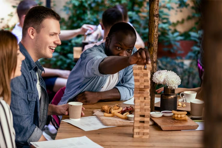 Colleagues enjoying coffee and food at a workplace event