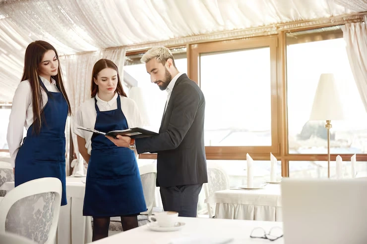 Event manager reviewing the delivery plan with crew at a venue