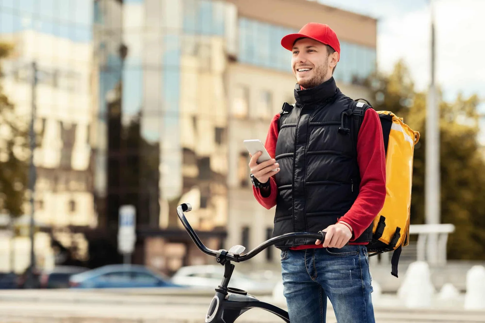 Positive Courier With Smartphone Using Delilvery App Working In City